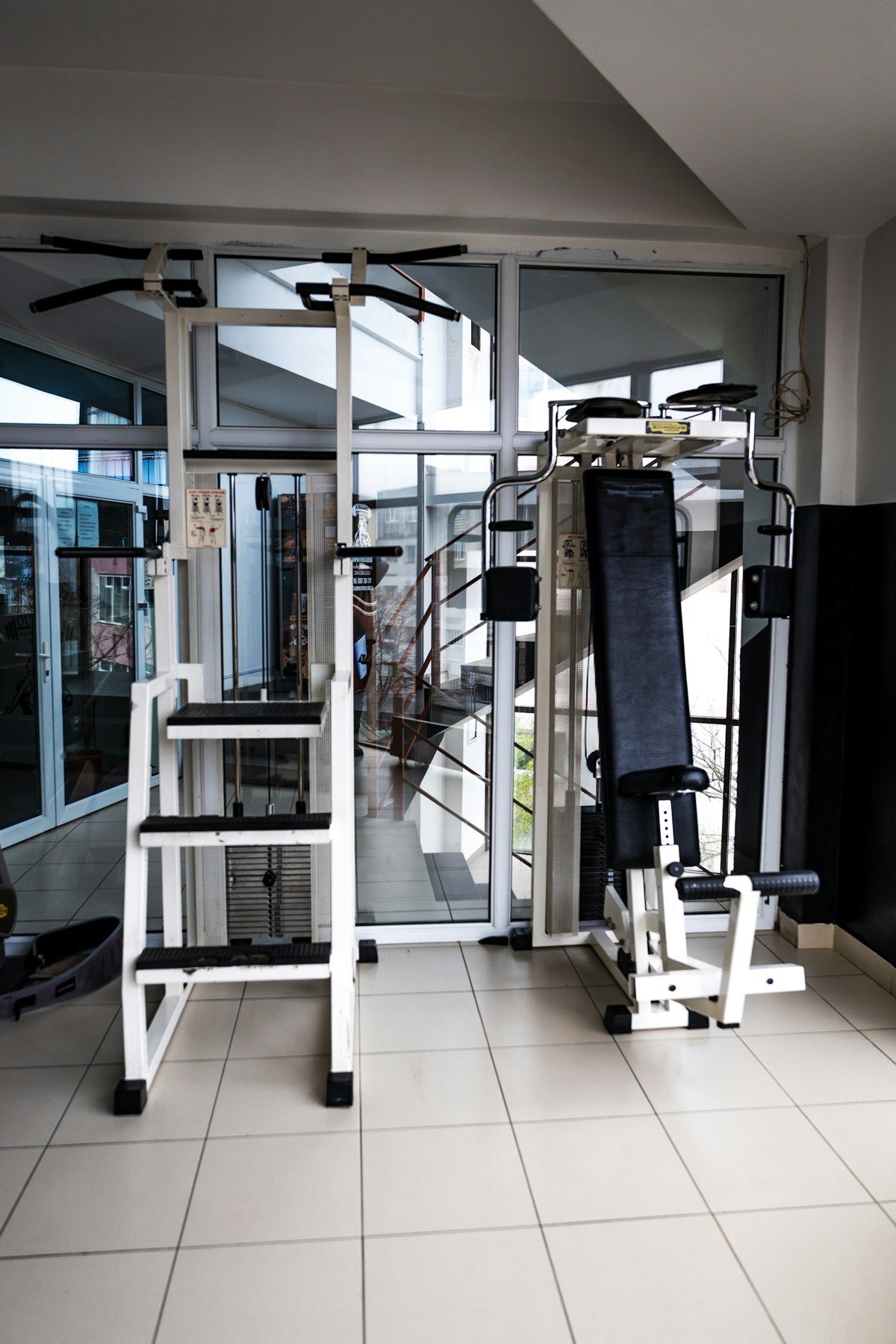White selectorized strength machines in a fitness center